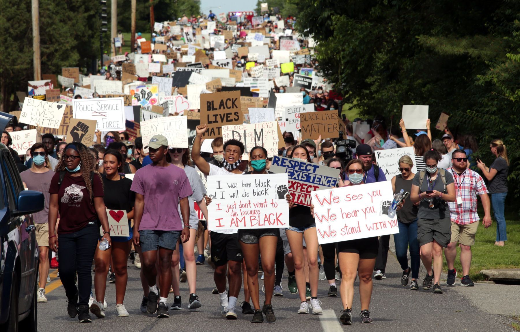 Youth march moves through wealthy suburbs